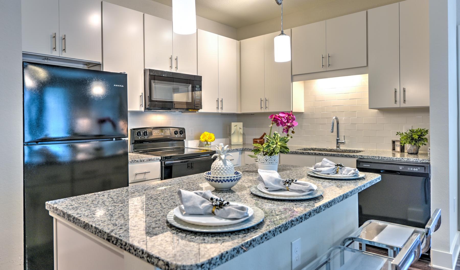 a kitchen with white cabinets