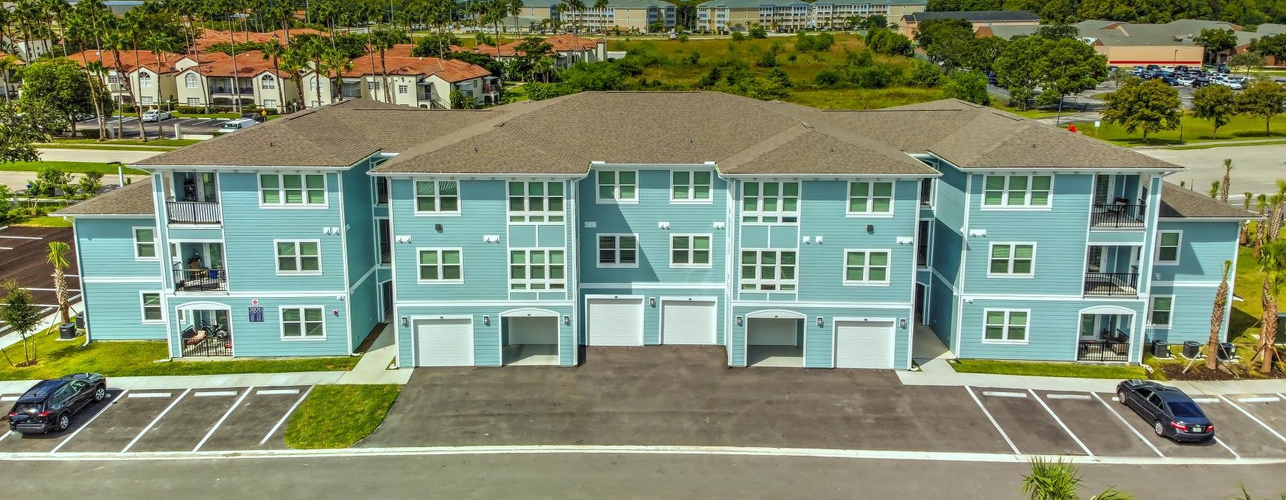 a building with cars parked in front