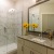 a bathroom with a tub sink and flowers