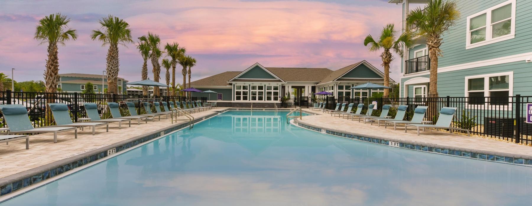 a pool with a building in the background