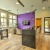 a large kitchen with a large purple flower arrangement