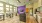 a large kitchen with a large purple flower arrangement