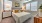 a bedroom with a bed and lamps
