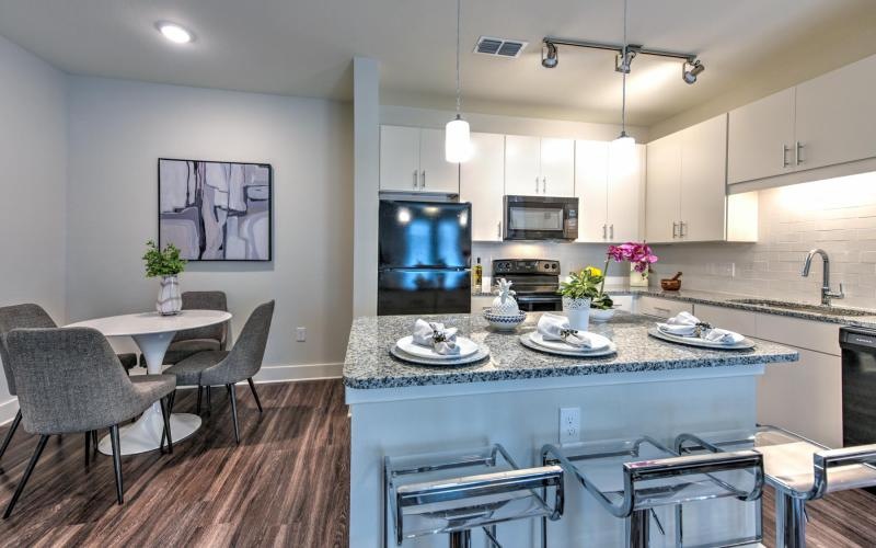 a kitchen with a table and chairs